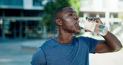 Buy stock photo Fitness, drinking and black man with water in city for outdoor rest, workout break or hydration. Active, male person or runner with mineral liquid or bottle for nutrition or recovery in an urban town