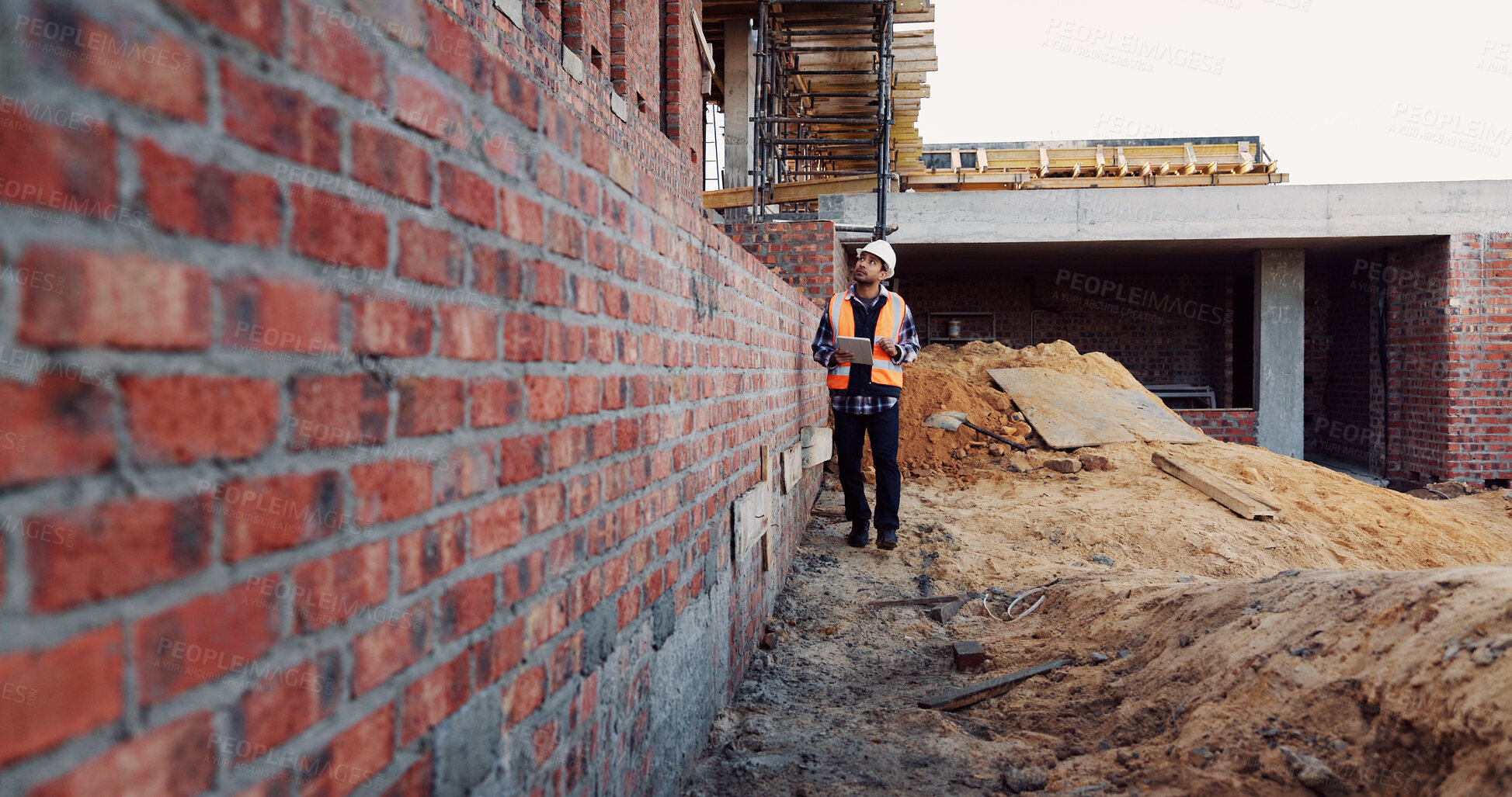 Buy stock photo Architecture, inspection and man with tablet at construction site, online and project update on web. Outdoor, civil engineer and person with tech for property development, report or quality assurance