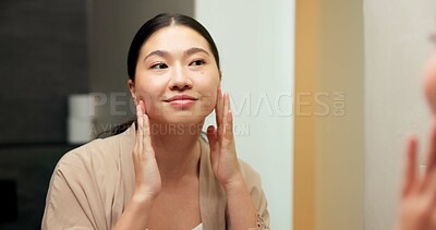 Buy stock photo Mirror, check and woman in bathroom for skincare, grooming and dermatology for healthy skin and glow. Reflection, home and Asian person with smile, hygiene and self care with cosmetics for beauty