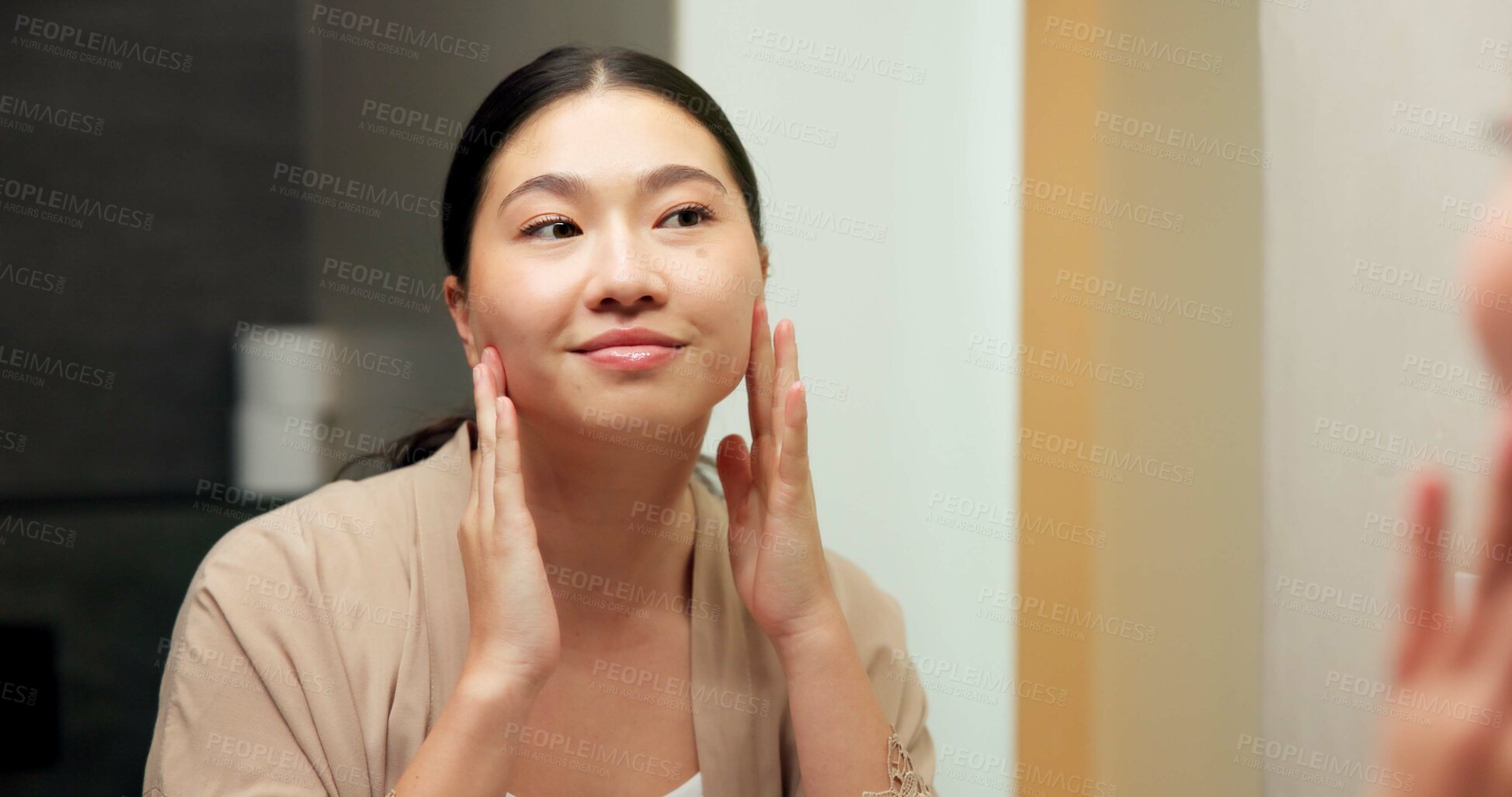 Buy stock photo Mirror, check and woman in bathroom for skincare, grooming and dermatology for healthy skin and glow. Reflection, home and Asian person with smile, hygiene and self care with cosmetics for beauty