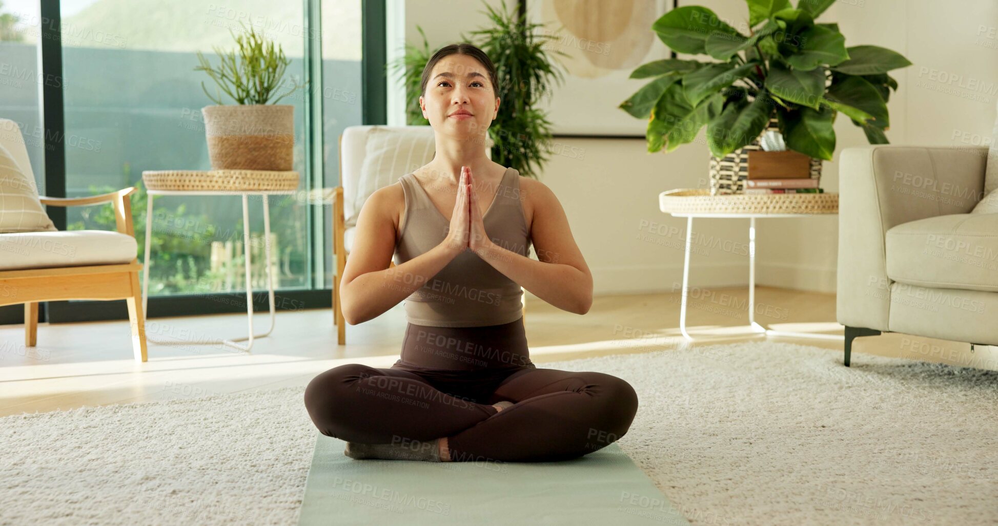 Buy stock photo Happy, meditation and Asian woman in home with prayer hands for mindfulness, wellness and calm. Morning, apartment and person on mat for breathing exercise, spiritual awareness and reflection