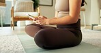 Yoga mat, typing and hands of woman in home for social media, health app and wellness article. Apartment, online and person on cellphone for research, internet and website for fitness or exercise