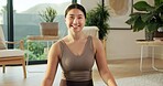 Portrait, woman and happy with yoga in home for holistic practice, exercise rest and self care. Yogi, asian person and relax with smile in living room for fitness break, morning wellness and health