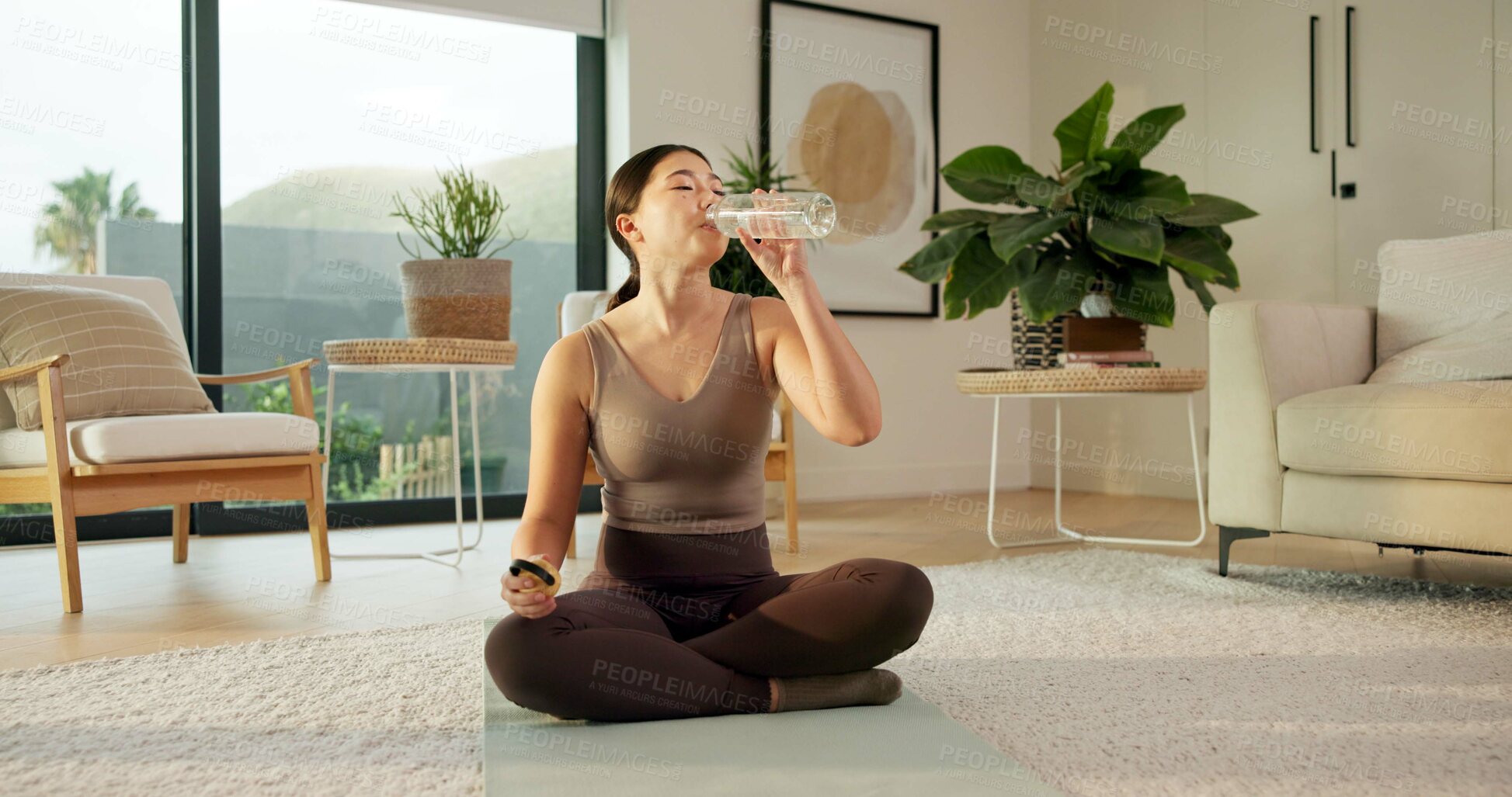Buy stock photo Woman, drink and yoga with water in home for mindfulness, hydration or balance. Female person, relax or break with rest, mineral liquid or beverage for zen, awareness or sustainability in house