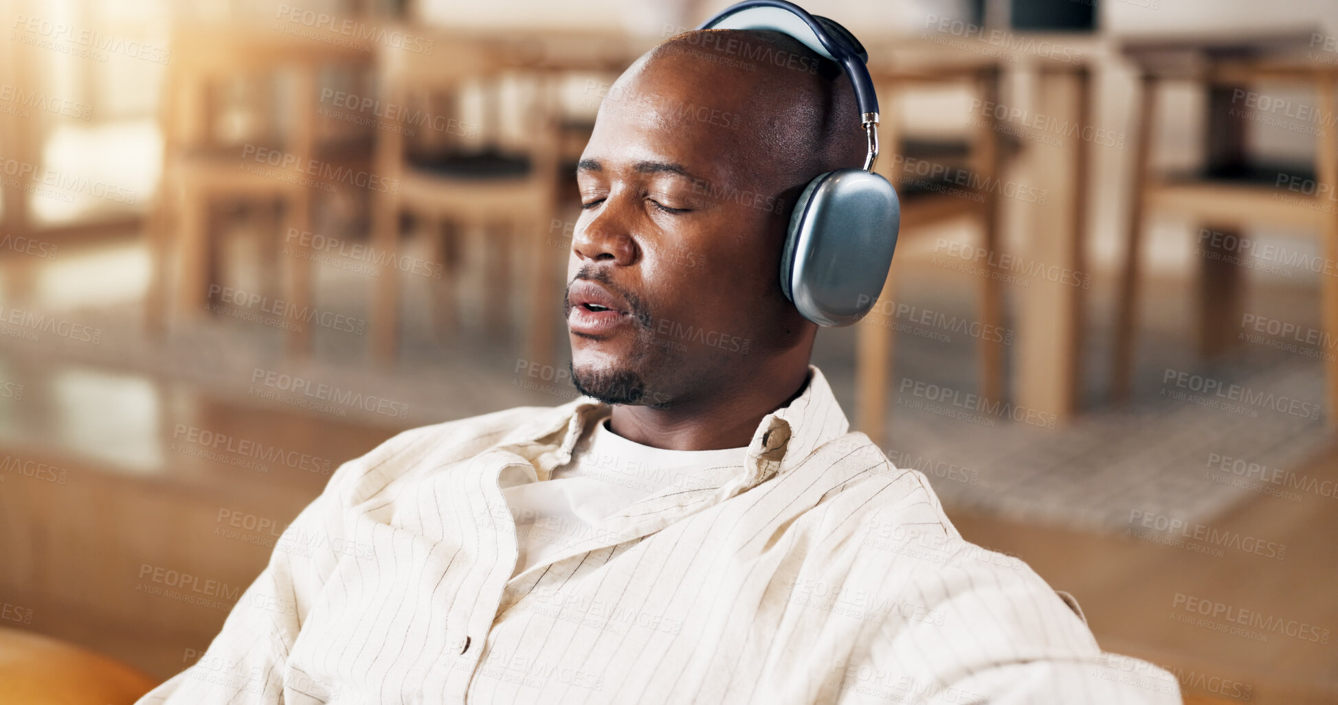 Buy stock photo Break, headphones and zen with black man on sofa in home living room for me time or wellness. Listening to music, relax and weekend with calm person in apartment for audio, song or sound streaming