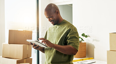 Buy stock photo Boxes, interior design and tablet with happy man in new house for diy project or renovation. App, planning and smile with black person in apartment for development or home improvement as homeowner