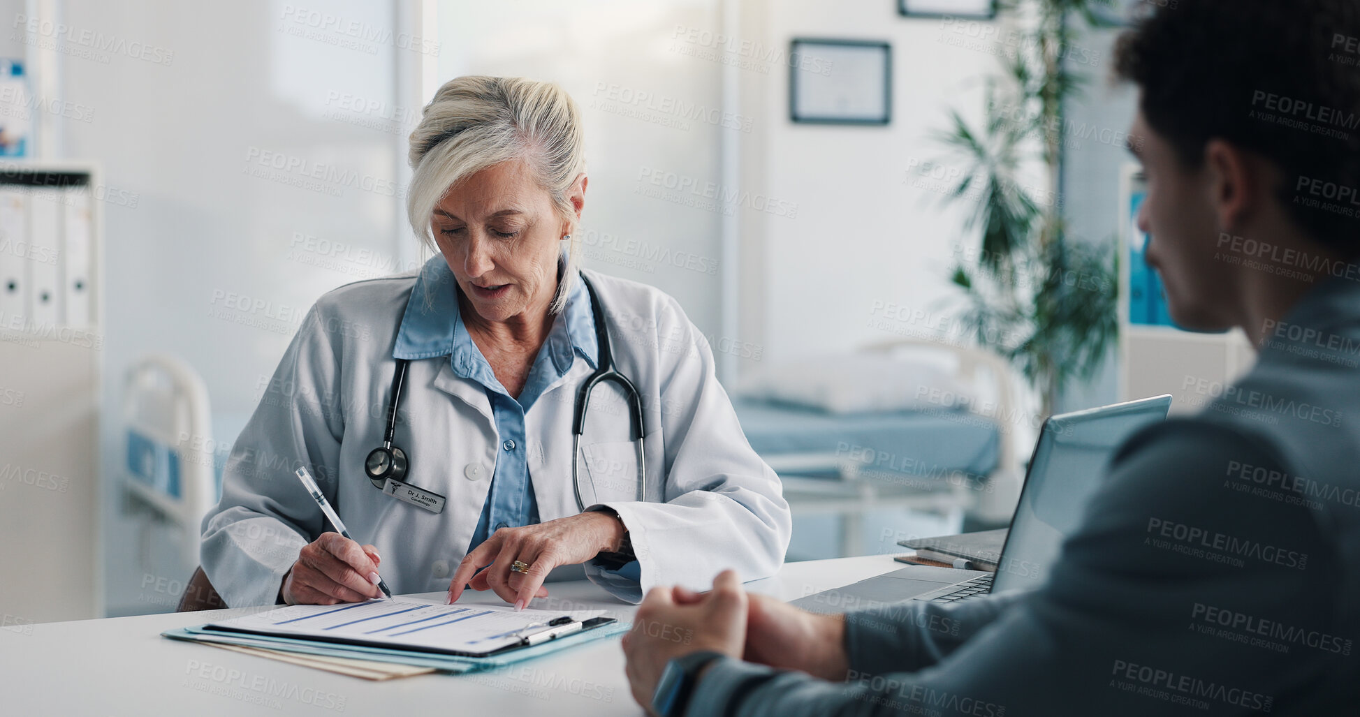 Buy stock photo Clipboard, checkup and doctor with man in hospital for discussion on medical diagnosis. Documents, writing and healthcare worker with male patient in conversation for treatment plan in clinic.