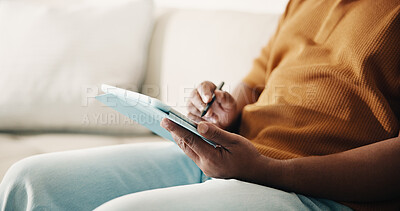 Buy stock photo Hands, tablet and writing with man on sofa in home living room for break, browsing or planning. App, pen and social media with person in apartment for online calendar, research or weekend schedule