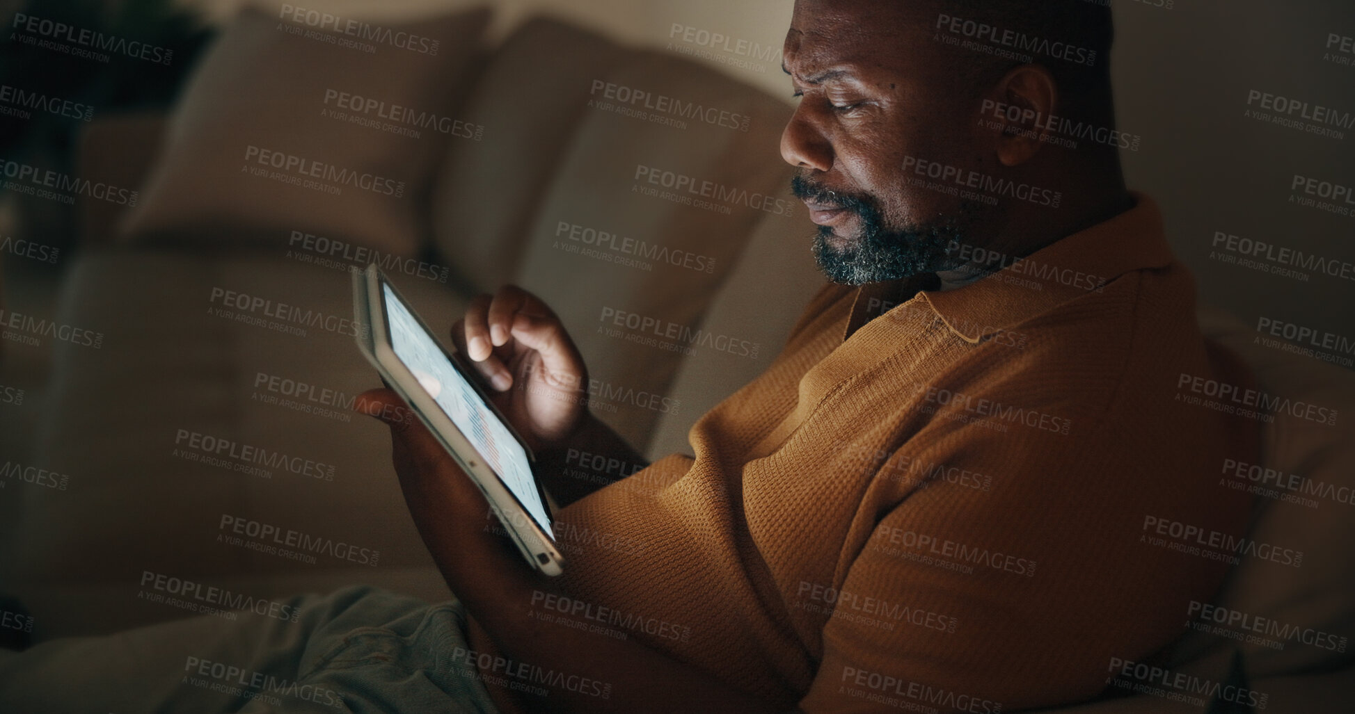 Buy stock photo Night, data analysis or black man in home with tablet screen, forecast or budget report in remote work. WFH, mature person or finance analyst with tech, performance track or stats monitor in dark.