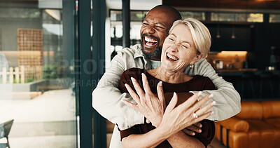 Buy stock photo Hug, laugh or interracial couple in house with love, happy moment or bonding on weekend break. Smile, fun or mature people with embrace, joke reaction or romantic connection in healthy relationship.
