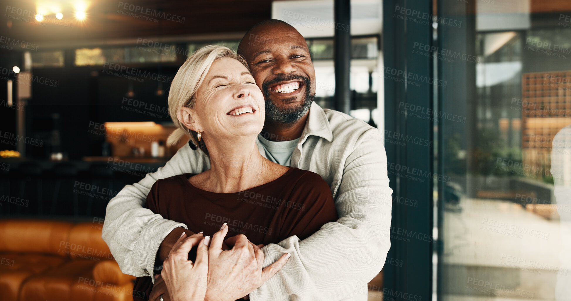 Buy stock photo Love, hug or interracial couple in home with pride, partner care or bonding on weekend break. Trust, portrait or mature people with smile, connection or romantic embrace in healthy relationship.
