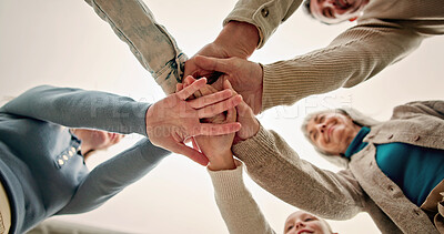 Buy stock photo Hands, huddle and people in circle together for solidarity, teamwork or unity from below. Connection, palm and stack with family group in collaboration for celebration, motivation or support