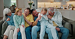 Laugh, relax and big family on sofa in home with ticking, bonding and care on weekend. Smile, love and children with grandparents and parents in living room for connection together in apartment.