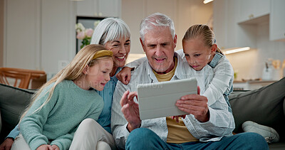 Buy stock photo Tablet, typing and grandparents with children on sofa in home for love, social media and connection. Online post, support and visit with senior man and woman with kids in living room in house