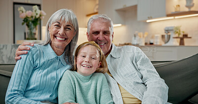 Buy stock photo Portrait, grandparents and girl on sofa with care, bonding together and support in loving relationship. Trust, family and grandchild in house with embrace, security and happy connection in childcare.