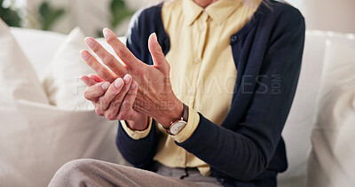 Buy stock photo Home, hands and senior person with joint pain for arthritis inflammation, chronic illness or massage. Retirement, pensioner and finger stiffness on sofa with discomfort, rheumatism risk and grip loss