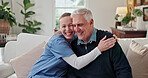 Caregiver, hug and laugh in nursing home with old man, healthcare or funny joke for bonding together. Portrait, happy nurse and embrace in retirement center with senior person, humor or elderly care.