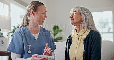 Buy stock photo Nurse, talking and senior woman with pills, medicine and advice for dosage, consulting and treatment. Healthcare, home and caregiver with elderly patient to explain medication, antibiotics or tablets