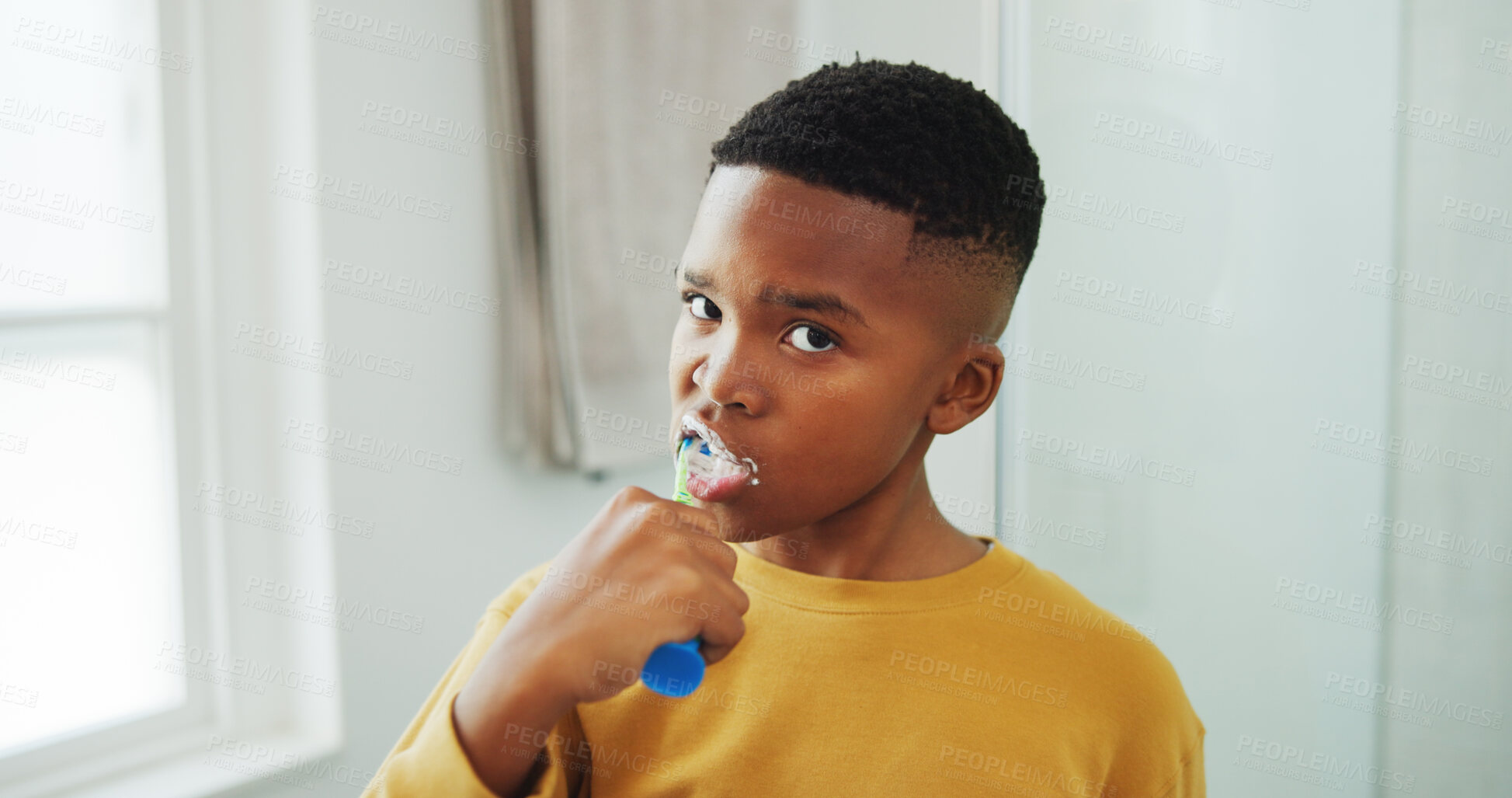 Buy stock photo Dental hygiene, portrait and black child brushing teeth in bathroom for health, wellness or morning. Toothbrush, oral care and boy kid with clean mouth for fresh breath or grooming routine in house.