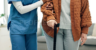 Buy stock photo Elderly, caregiver and woman with cane in hands, support and assistance for rehabilitation in home. Healthcare nurse, help and senior person with disability, walking stick and physical therapy.