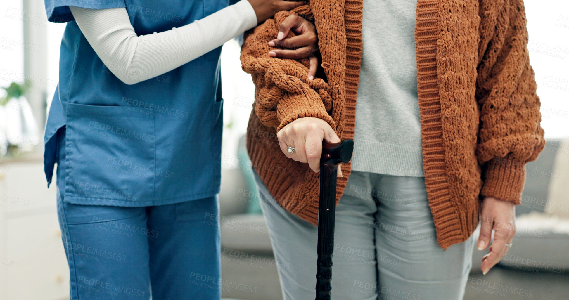Buy stock photo Elderly, caregiver and woman with cane in hands, support and assistance for rehabilitation in home. Healthcare nurse, help and senior person with disability, walking stick and physical therapy.