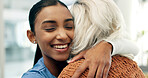 Senior, woman and caregiver hug in nursing home with smile, healthcare assistance or wellness support. Happy, nurse and elderly person in consultation with embrace, medical help and bonding together.