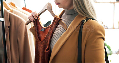 Buy stock photo Hand, clothes and woman in store, choice and shopping with retail therapy, options and fashion. Customer, luxury design and person in boutique, discount deal and sale for product and inspection