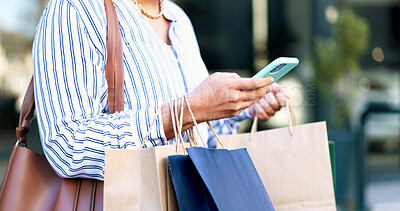 Buy stock photo Cellphone, shopping bags and hands of woman in city with online sale, discount or promotion with retail. Technology, customer and female person with phone for ecommerce purchase in urban town.