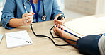 Doctor, patient and hands in clinic with blood pressure machine, wellness and healthcare checkup. Medical worker, people and equipment in consultation for hypertension, test results and diagnosis.