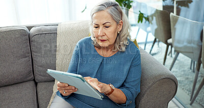 Buy stock photo Tablet, online and senior woman on sofa in home with reading blog on pension funds, savings or finance. Digital technology, relax and elderly female person with retirement planning in living room.