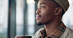 Black man, coffee and thinking in cafe for reflection, drink and relax with inspiration at restaurant. Person, daydreaming and cup with memory, remember and perspective with beverage at diner