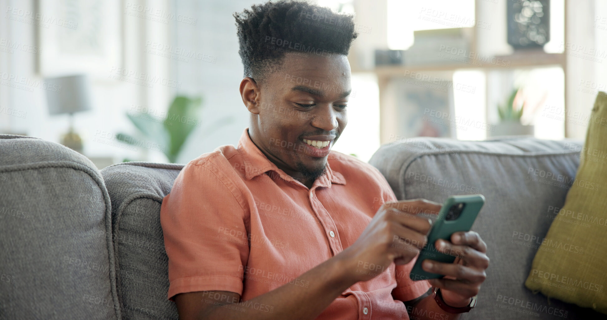 Buy stock photo Happy, phone and black man on sofa in home with networking, connection or texting on mobile app. Relax, technology and African male person with cellphone for chatting, communication or social media.