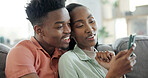 Couple, online and bonding with phone in lounge, entertainment and streaming video with subscription. Black people, scroll and happy with partner on couch, love and watch movie with mobile in house