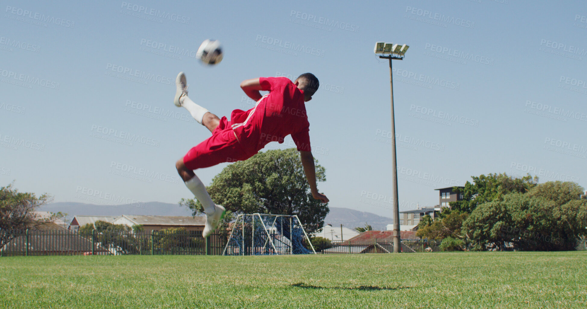 Buy stock photo Man, kick and ball on field for soccer, fitness skills and match practice for competition. Male person, jump or action with equipment at park for football, exercise and training for sports tournament