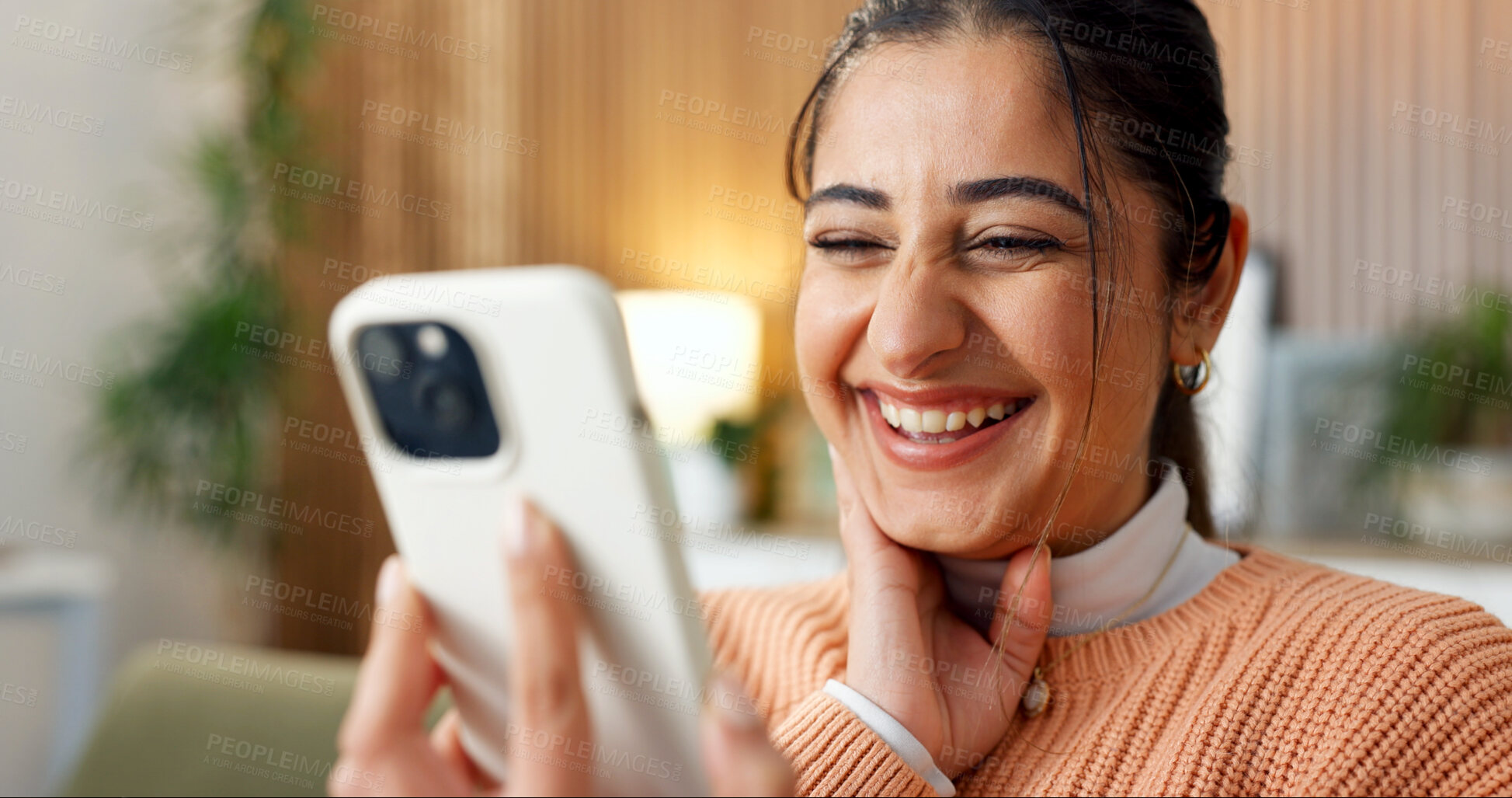 Buy stock photo Laugh, online and woman in home with phone, funny conversation and message notification on weekend. Happy, relax and person with cellphone for internet humor, website and social media in living room