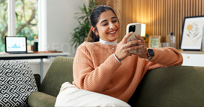 Buy stock photo Happy, typing and woman on sofa with phone, online conversation and message notification on weekend. Home, smile and person relax with cellphone for internet, website and social media in living room