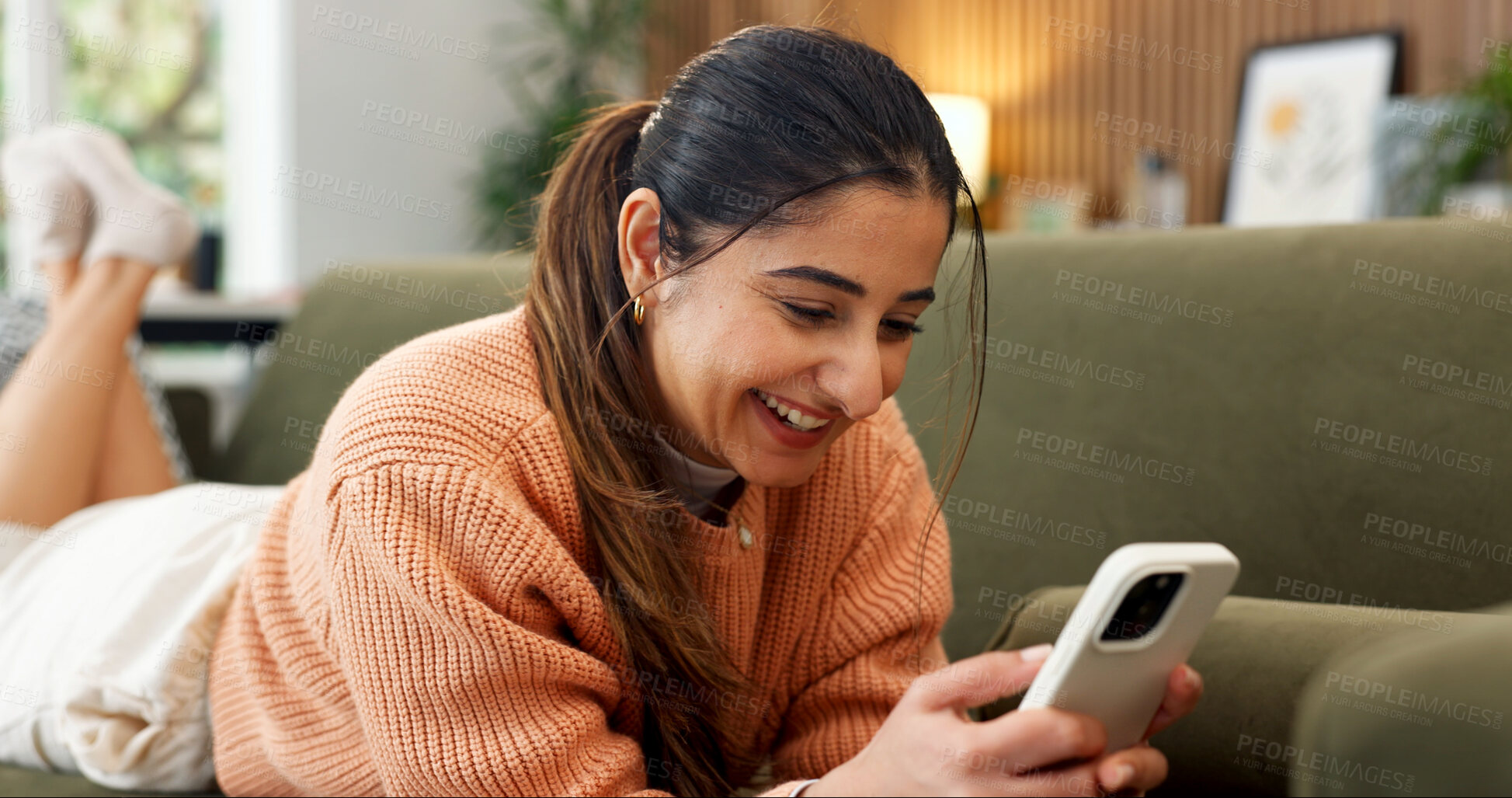 Buy stock photo Happy, relax and woman on sofa with phone, online conversation and message notification on weekend. Home, smile and person typing on cellphone for internet, website and social media in living room