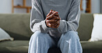 Anxiety, sofa and hands of woman for overthinking, counseling session and help for mental health. Anxious, couch and person with nervous, overwhelmed and worry for decision, future and mistake