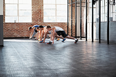 Buy stock photo Shot of a group of people doing a fitness class