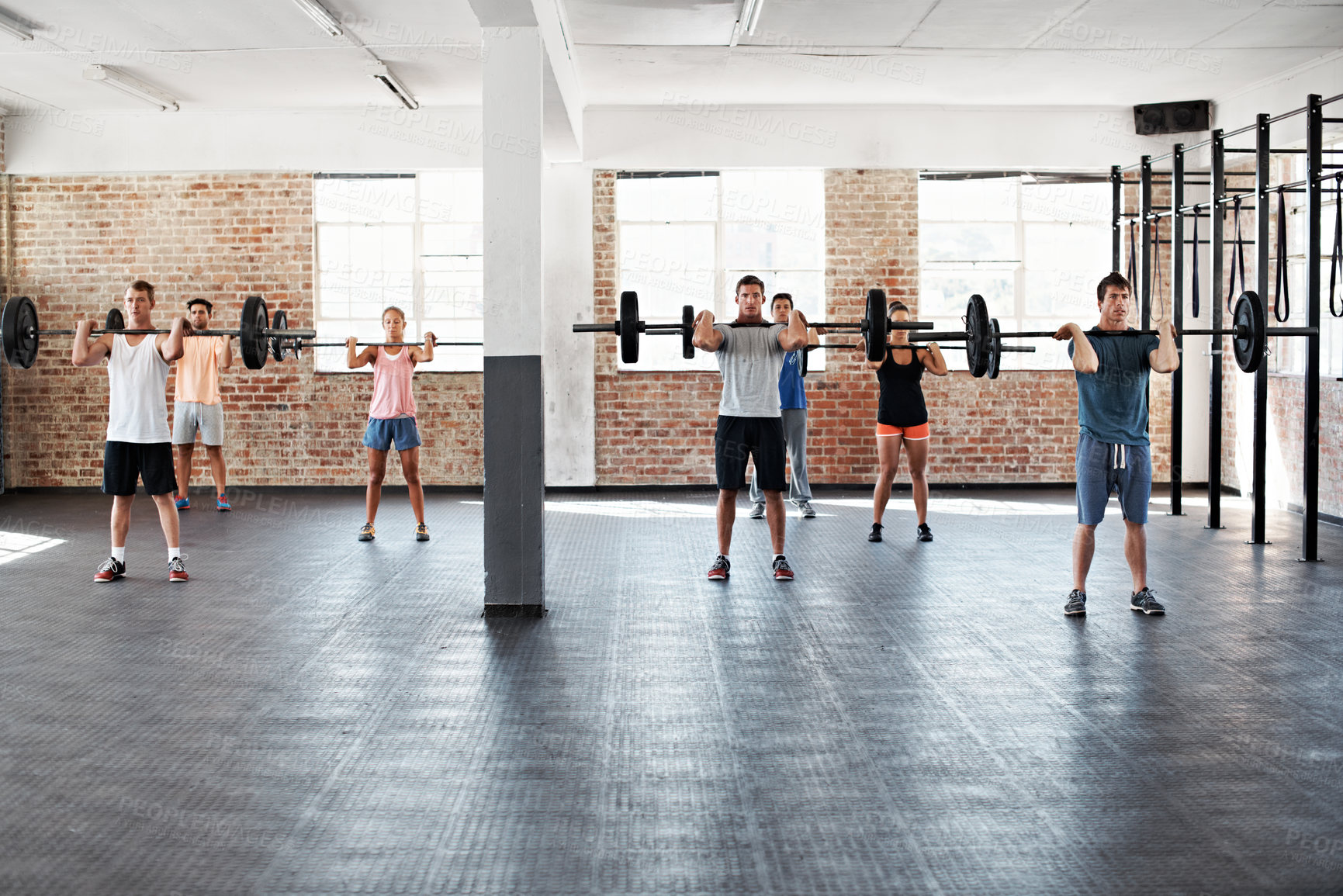 Buy stock photo People, gym or weightlifting class with barbell for strength workout, training or muscle building. Active, group or lifting with weights for fitness, power or arm exercise on space in health club