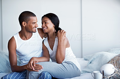 Buy stock photo Cropped shot of a young couple enjoying their morning at home