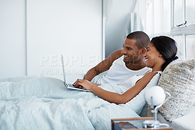 Buy stock photo Cropped shot of a young couple enjoying their morning at home