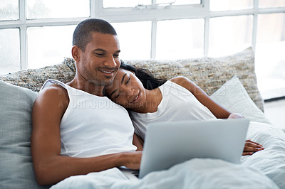 Buy stock photo Cropped shot of a young couple enjoying their morning at home