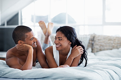 Buy stock photo Cropped shot of a young couple enjoying their morning at home