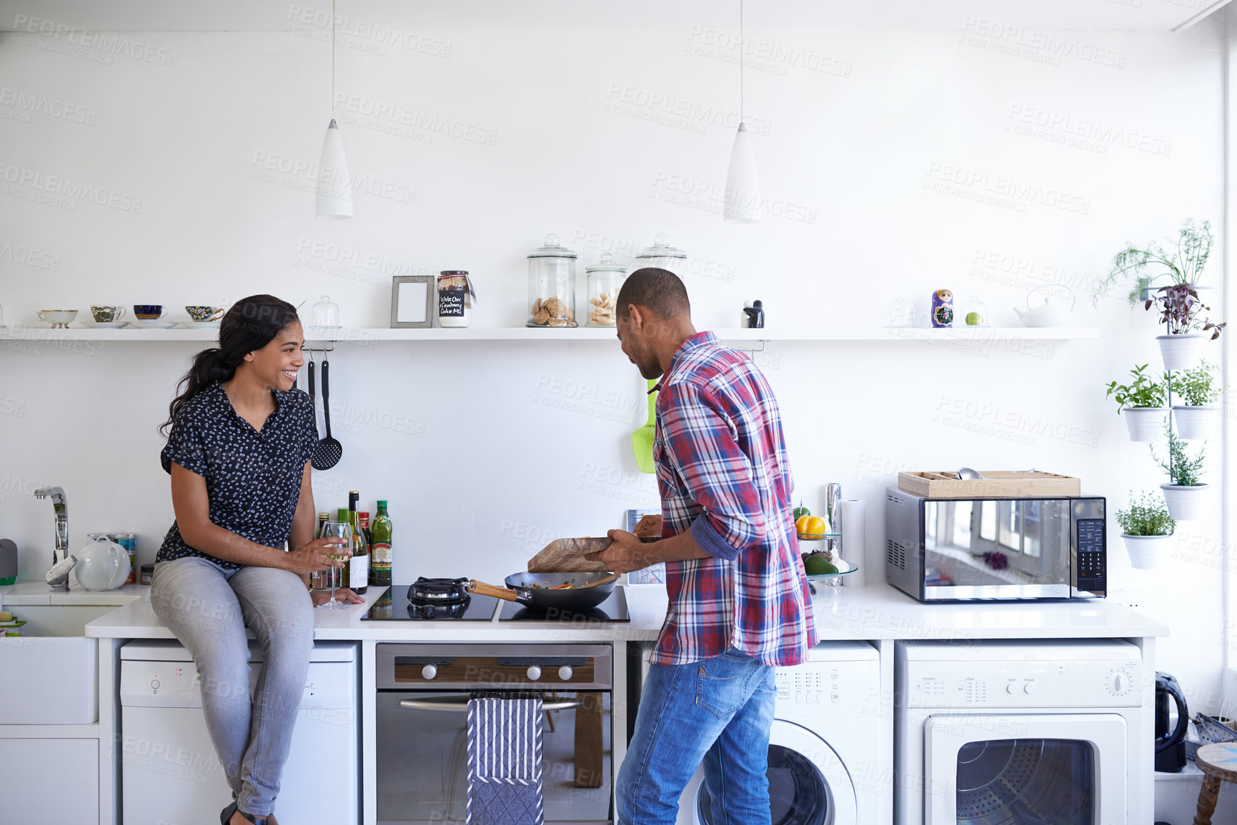 Buy stock photo Cooking, conversation and couple in kitchen at house for diet, healthy or wellness dinner with support. Ingredients, happy and man with woman with wine for preparing supper, meal or food together.