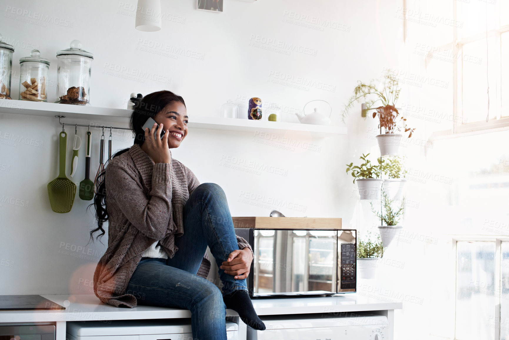 Buy stock photo Phone call, contact and woman in kitchen with smile, networking and communication in online chat. Happy, gossip and black person in house with tech, conversation or connection with digital discussion