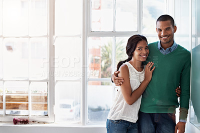 Buy stock photo Cropped portrait of an affectionate young couple standing in their home