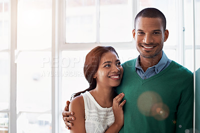 Buy stock photo Cropped portrait of an affectionate young couple standing in their home