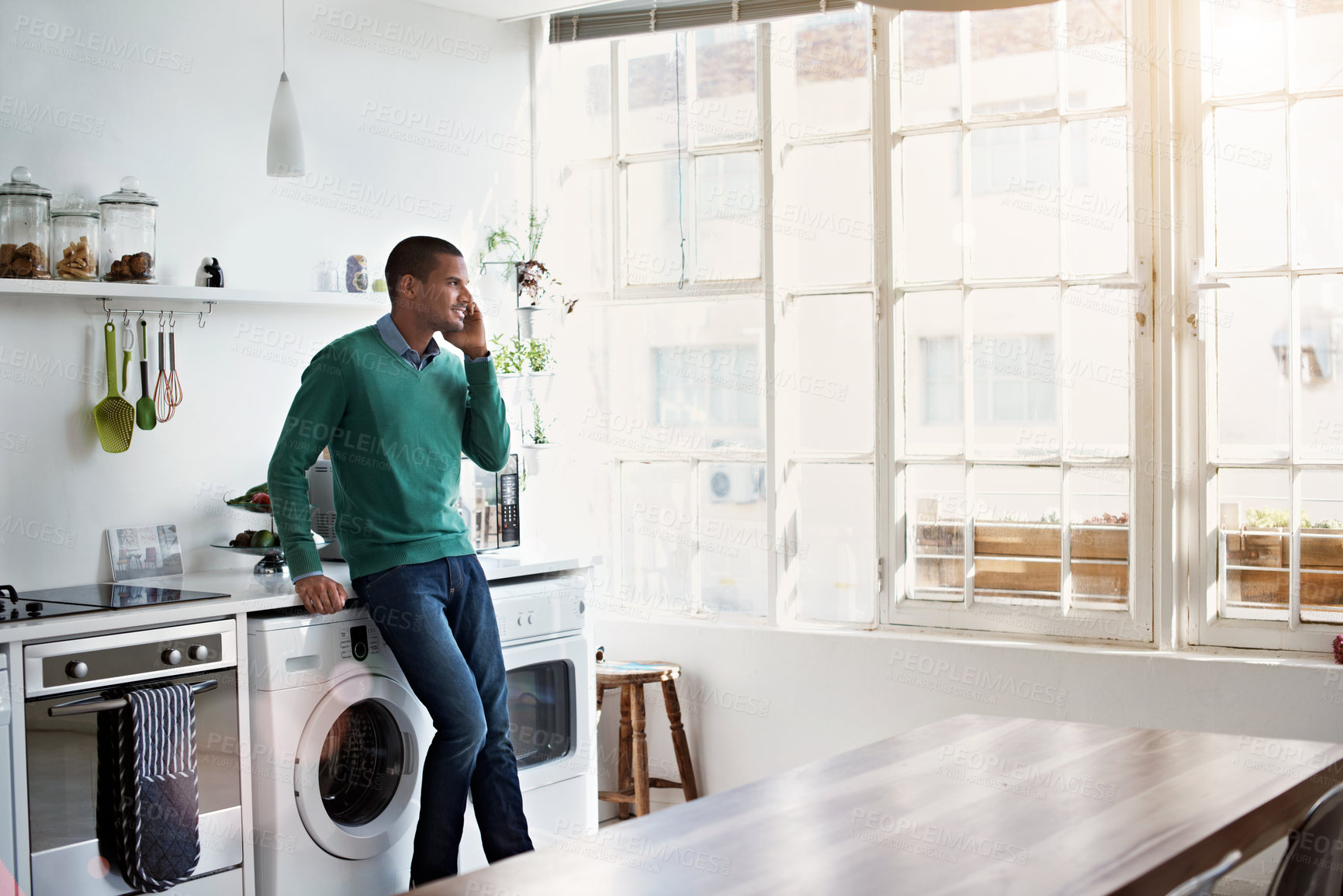Buy stock photo Phone call, happy and man in kitchen with contact, networking and communication in online chat. Smile, feedback and person in house with tech, conversation and connection with digital discussion.