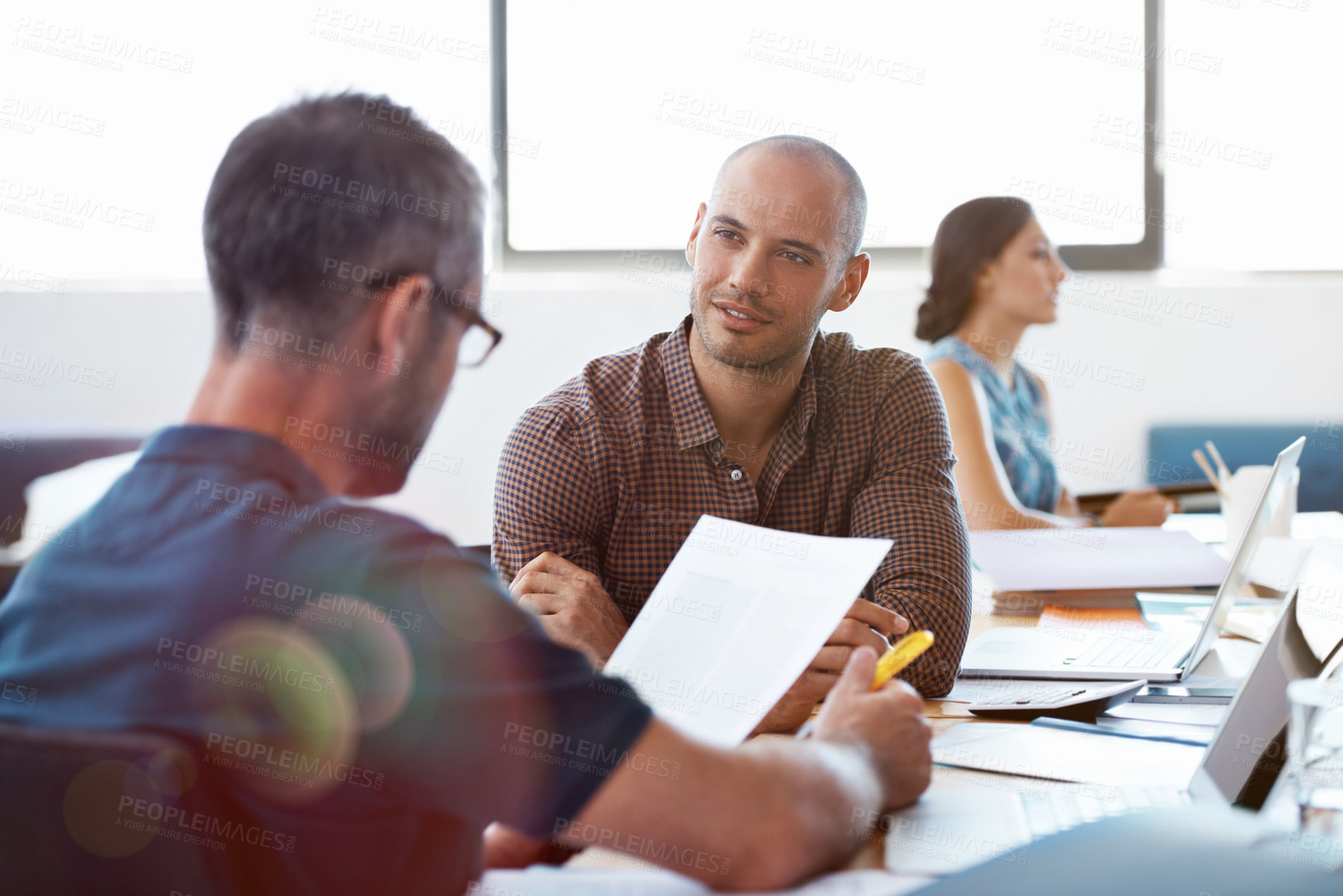 Buy stock photo Man, paperwork and meeting in office with coworker, review timesheet and revenue for payroll report. People, collaboration and check document in business to track employee hours, taxes and salary.